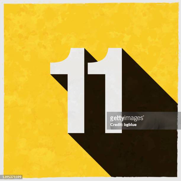 11 - number eleven. icon with long shadow on textured yellow background - eleventh stock illustrations