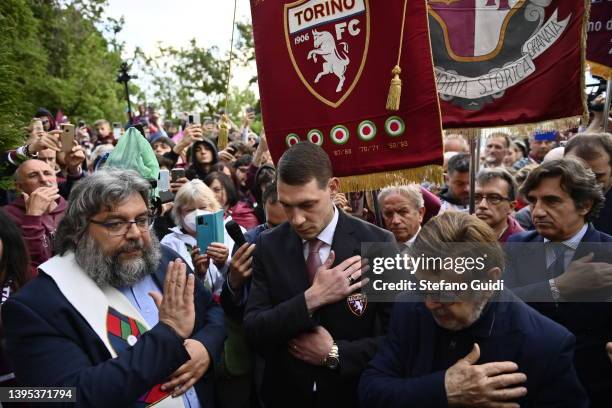 Andrea Belotti reads a name from the Grande Torino team on a tombstone during a memorial to mark the 73rd anniversary of the Superga air disaster on...
