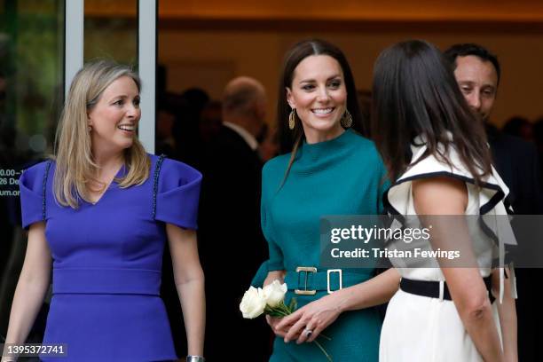 Catherine, Duchess of Cambridge speaks to British Fashion Council Chair Stephanie Phair and Chief Executive of the British Fashion Council Caroline...
