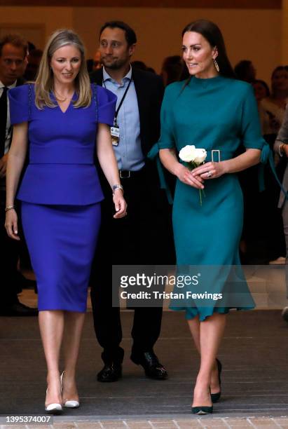 Catherine, Duchess of Cambridge walks with British Fashion Council Chair Stephanie Phair as she departs the Design Museum on May 04, 2022 in London,...