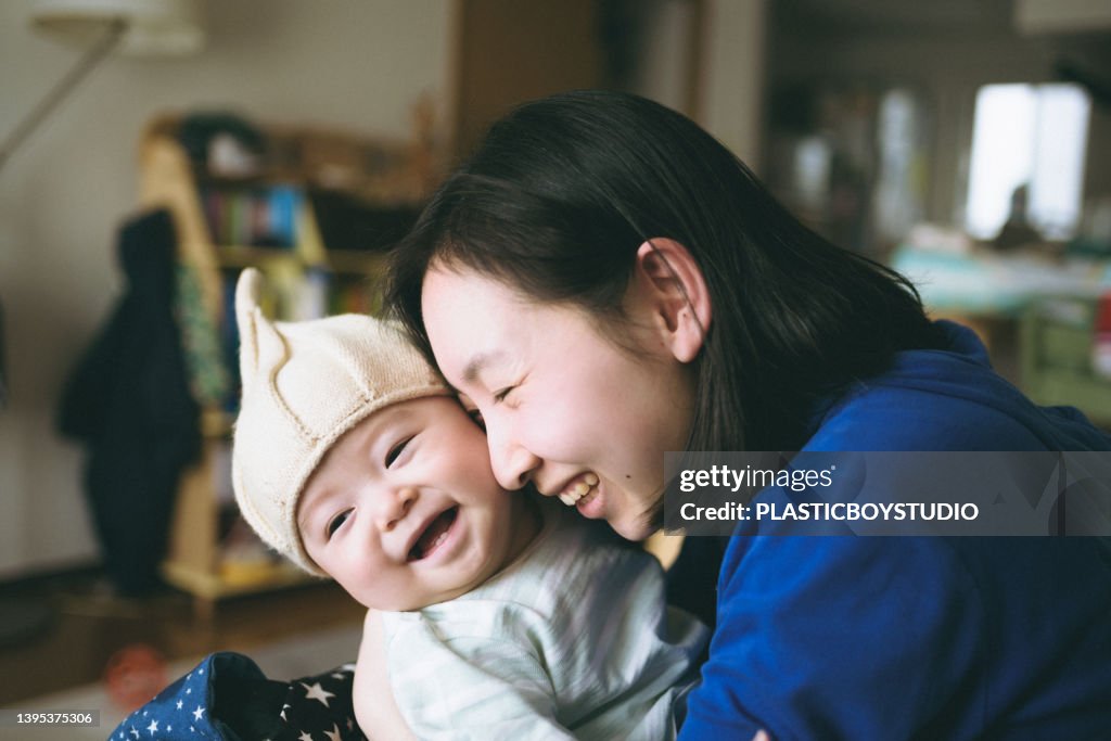 A smiling parent and child.