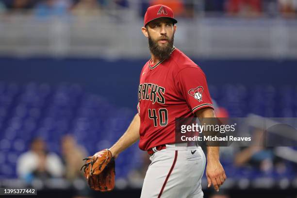Madison Bumgarner of the Arizona Diamondbacks yells at umpire Dan Bellino before being ejected from the game as he walks off the mound during the...