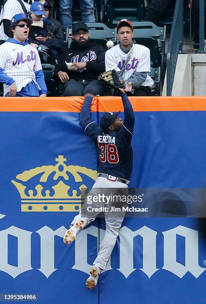 Guillermo Heredia of the Atlanta Braves makes a catch at the wall for the first out of the second inning against the New York Mets at Citi Field on...