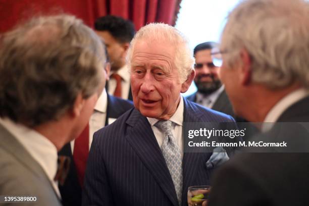 Prince Charles, Prince of Wales chats with guests during The National Pharmacy Association Reception at St James's Palace on May 04, 2022 in London,...