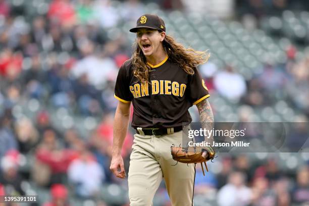 Starting pitcher Mike Clevinger of the San Diego Padres celebrates after striking out Owen Miller of the Cleveland Guardians to end the third inning...