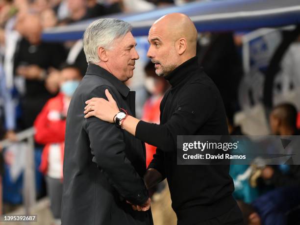 Carlo Ancelotti, Head Coach of Real Madrid shakes hands with Pep Guardiola, Manager of Manchester City prior to the UEFA Champions League Semi Final...