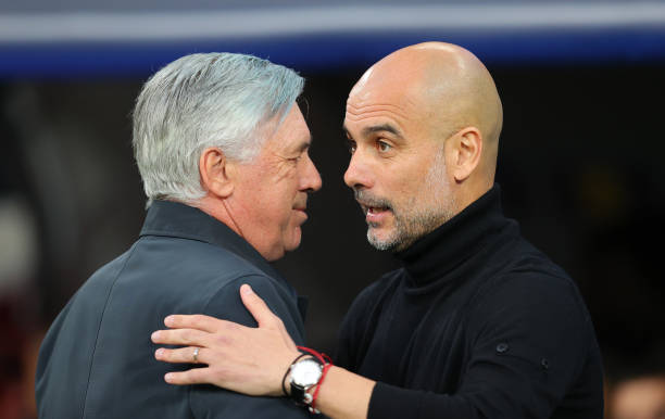 Carlo Ancelotti the manager of Real Madrid and Pep Guardiola the manager of Manchester City embrace prior to the UEFA Champions League Semi Final Leg...