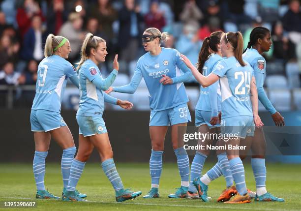 Lauren Hemp of Manchester City celebrates with team mates Chloe Kelly, Alanna Kennedy and Keira Walsh after scoring their sides second goal during...