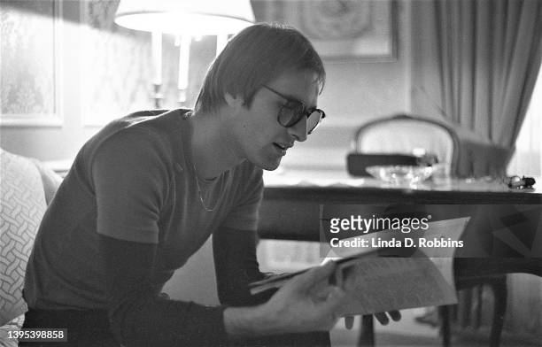 Steve Harley, singer of the British group Cockney Rebel, being interviewed in a New York hotel room, March 1975. He is reading an issue of...