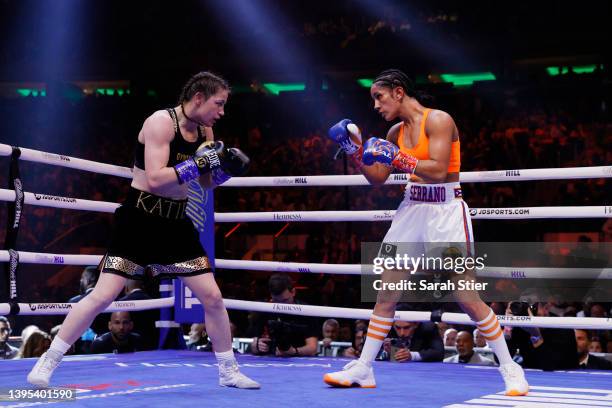 Katie Taylor of Ireland trades punches with Amanda Serrano of Puerto Rico for the World Lightweight Title fight at Madison Square Garden on April 30,...