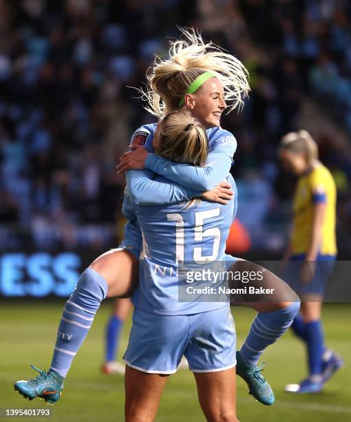 Chloe Kelly of Manchester City celebrates with team mate Lauren Hemp after scoring their sides fifth goal during the Barclays FA Women's Super League...