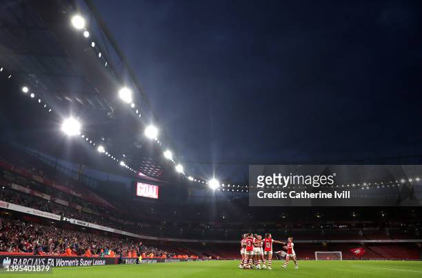 Caitlin Foord of Arsenal celebrates with team mates after scoring their side's second goal during the Barclays FA Women's Super League match between...