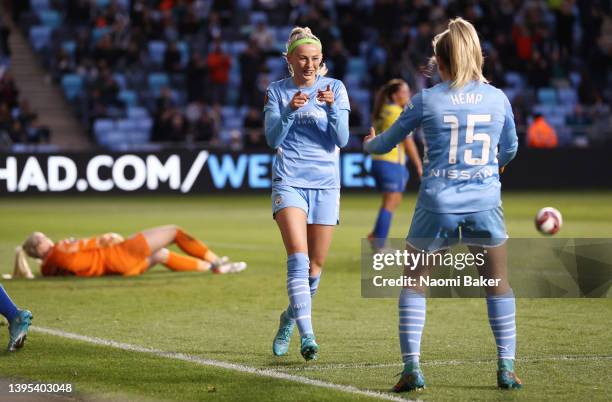 Chloe Kelly of Manchester City celebrates with team mate Lauren Hemp after scoring their sides fifth goal during the Barclays FA Women's Super League...