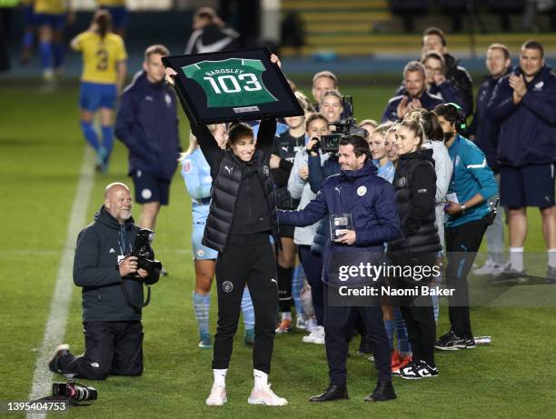 Karen Bardsley of Manchester City is presented with a framed shirt after announcing their retirement from professional football after the Barclays FA...