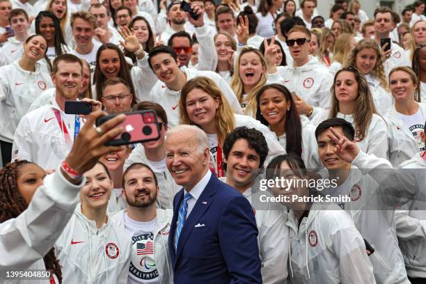 President Joe Biden gets a selfie picture with members of Team USA including Olympians and Paralympians on the South Lawn at the White House on May...