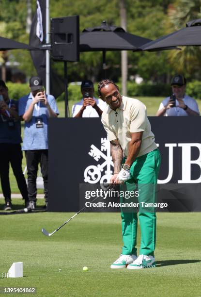Brand ambassador and seven-time Formula One World Champion Lewis Hamilton hits a golf ball during The Big Pilot Challenge, an entertaining charity...