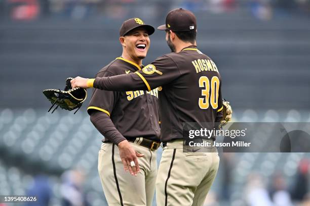 Manny Machado celebrates with Eric Hosmer of the San Diego Padres after the Padres defeated the Cleveland Guardians in game one of a doubleheader at...