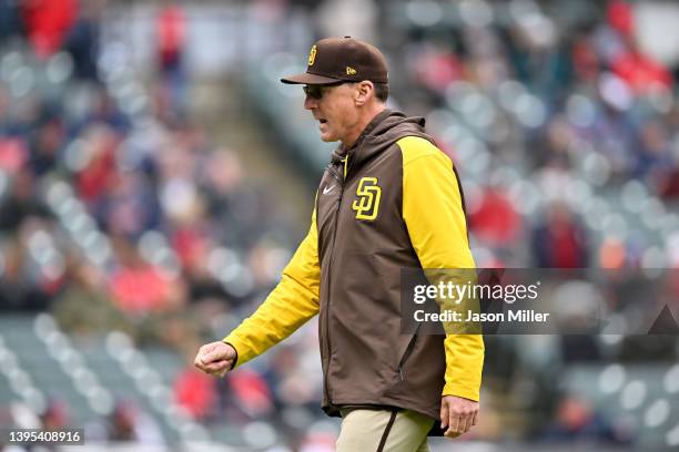 Manager Bob Melvin of the San Diego Padres returns to the dugout after a mound visit during the fifth inning of game one of a doubleheader against...