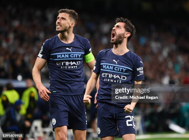 Ruben Dias and Bernardo Silva of Manchester City celebrate their side's first goal scored by Riyad Mahrez of Manchester City during the UEFA...