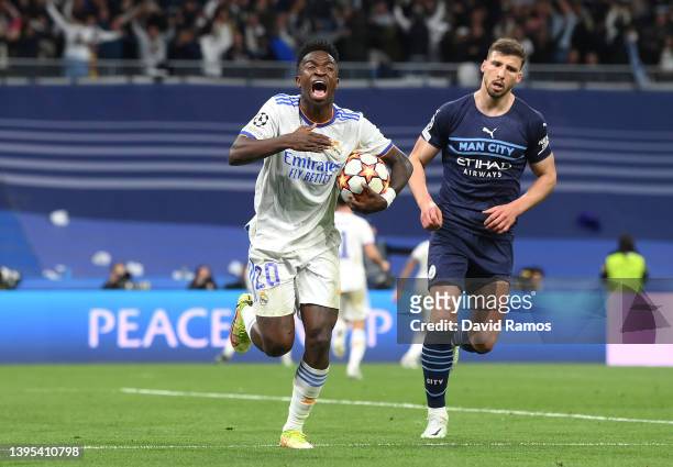 Vinicius Junior of Real Madrid celebrates after their side's second goal scored by Rodrygo of Real Madrid during the UEFA Champions League Semi Final...