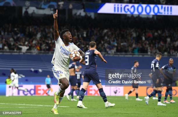 Vinicius Junior of Real Madrid celebrates after their side's second goal scored by Rodrygo of Real Madrid during the UEFA Champions League Semi Final...