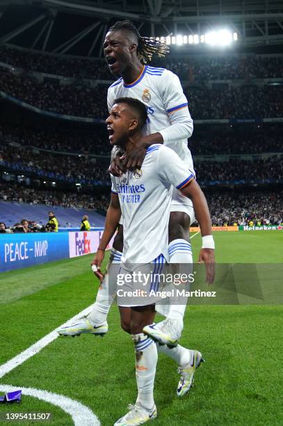 Rodrygo of Real Madrid celebrates with team mate Eduardo Camavinga after scoring their sides second goal during the UEFA Champions League Semi Final...