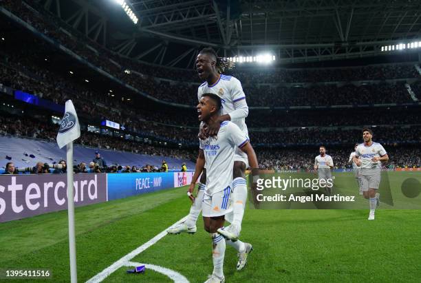 Rodrygo of Real Madrid celebrates with team mate Eduardo Camavinga after scoring their sides second goal during the UEFA Champions League Semi Final...