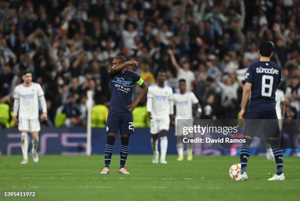 Fernandinho of Manchester City looks dejected after Karim Benzema of Real Madrid scores their side's third goal during the UEFA Champions League Semi...