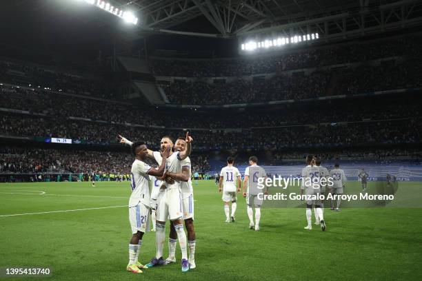 Karim Benzema of Real Madrid celebrates after scoring their side's third goal with Vinicius Junior during the UEFA Champions League Semi Final Leg...