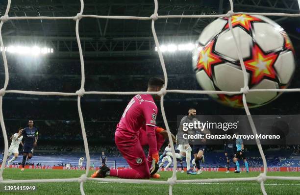 Karim Benzema of Real Madrid scores their side's third goal from the penalty spot during the UEFA Champions League Semi Final Leg Two match between...