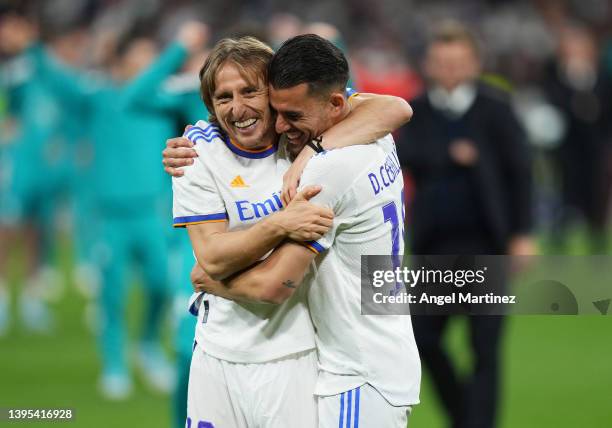 Luka Modric and Dani Ceballos of Real Madrid celebrate their side's victory and progression to the UEFA Champions League Final after the UEFA...