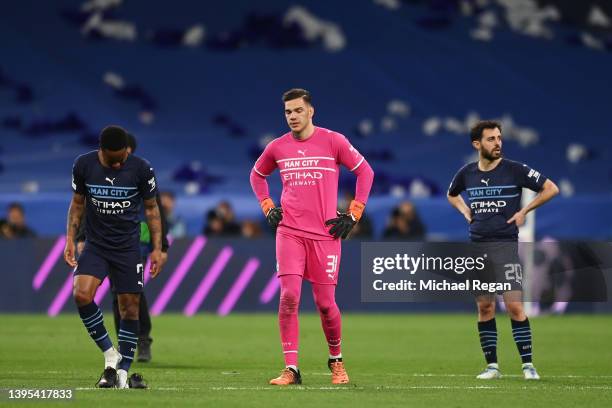 Raheem Sterling, Ederson and Bernardo Silva of Manchester City look dejected following their sides defeat after the UEFA Champions League Semi Final...