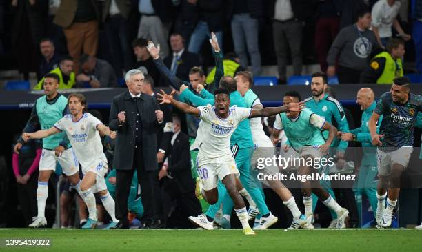 Luka Modric, Vinicius Junior and Carlo Ancelotti, Head Coach of Real Madrid celebrate their side's victory and progression to the UEFA Champions...
