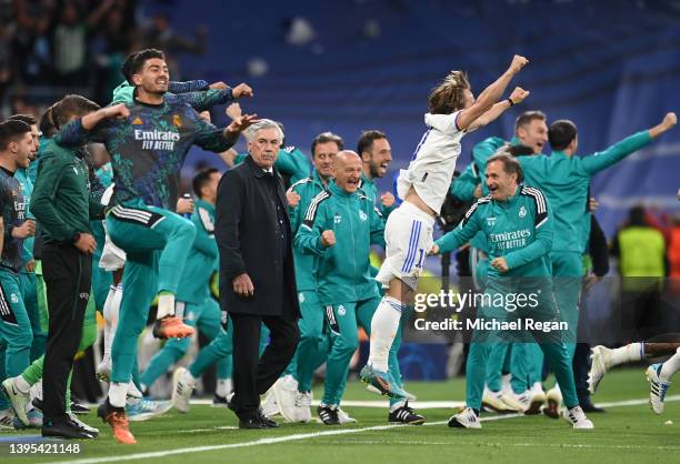 Luka Modric of Real Madrid and team mates along with Carlo Ancelotti, Head Coach of Real Madrid celebrate their side's victory on the final whistle...