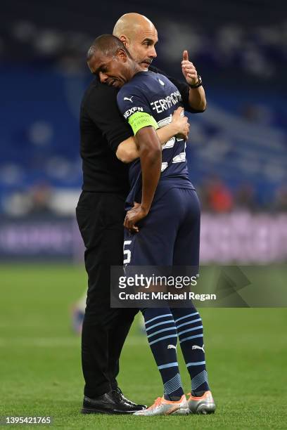 Pep Guardiola, Manager of Manchester City consoles a dejected Fernandinho of Manchester City after defeat inthe UEFA Champions League Semi Final Leg...