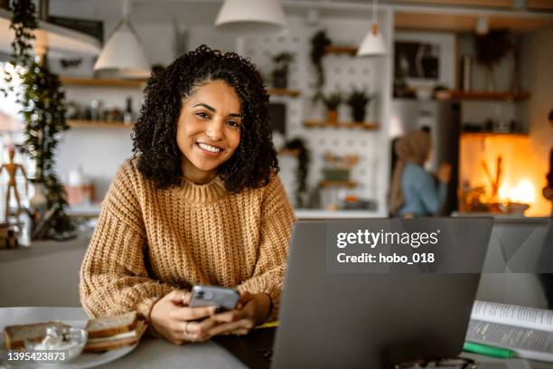 portrait of young cute mixed race woman at home - generation x stock pictures, royalty-free photos & images