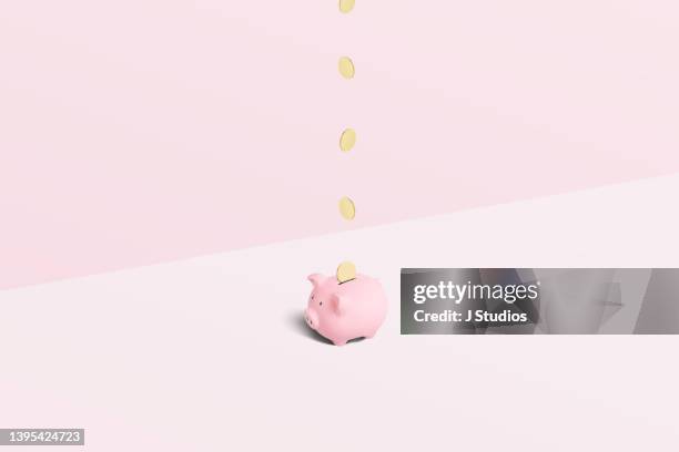 piggy bank with gold coins - piggy bank stock pictures, royalty-free photos & images