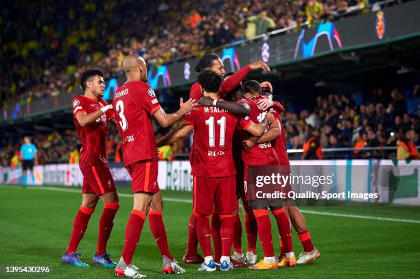 Sadio Mane of Liverpool celebrates with team mates after scoring his team's third goal during the UEFA Champions League Semi Final Leg Two match...