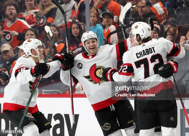 Brady Tkachuk of the Ottawa Senators celebrates his third period powerplay game winning goal with teammates Josh Norris, Tim Stutzle and Thomas...