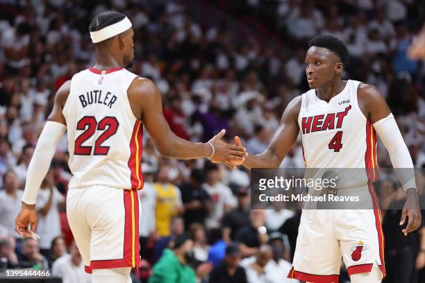 Jimmy Butler and Victor Oladipo of the Miami Heat high five against the Philadelphia 76ers during the second half in Game Two of the Eastern...