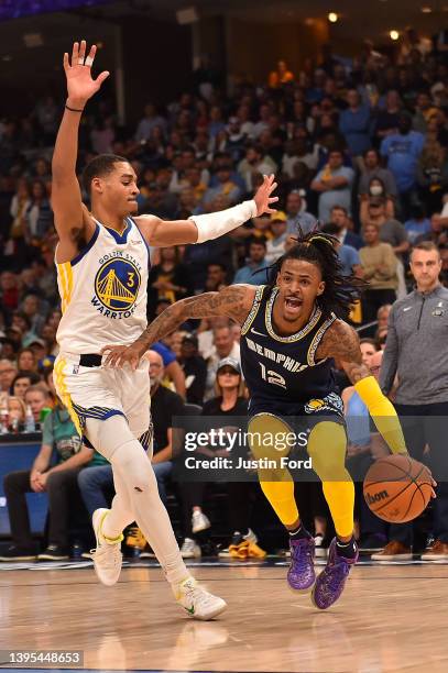 Ja Morant of the Memphis Grizzlies goes to the basket against Jordan Poole of the Golden State Warriors during Game Two of the Western Conference...