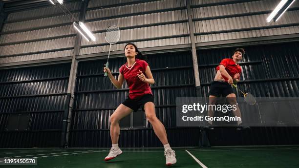 《badminton spirit》power attack/ jump smash - badminton sport stock pictures, royalty-free photos & images