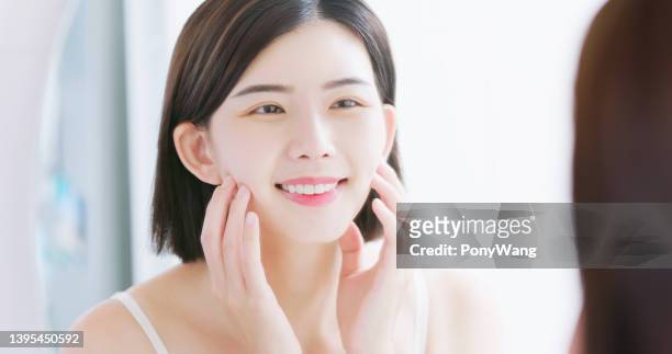beauty woman look mirror - human skin stock pictures, royalty-free photos & images