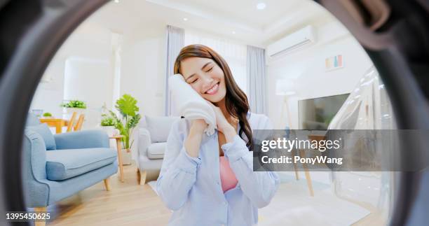 woman take clothes from washer - view from inside washer stock pictures, royalty-free photos & images
