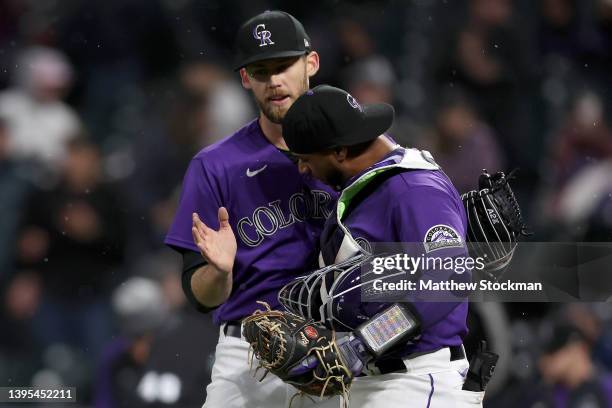 Pitcher Daniel Bard and catcher Elias Diaz of the Colorado Rockies celebrate after the last out against the Washington Nationals in the ninth inning...