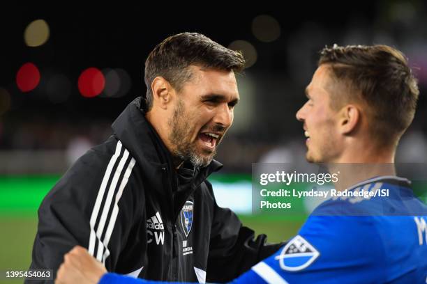 San Jose Earthquakes interim assistant coach Chris Wondolowski celebrates with Paul Marie during a game between Seattle Sounders FC and San Jose...