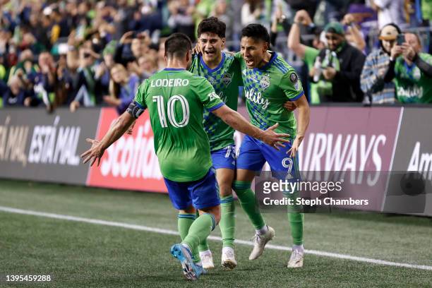 Raúl Ruidíaz of Seattle Sounders celebrates his goal with Obed Vargas and Nicolás Lodeiro against Pumas in the second half during 2022 Scotiabank...