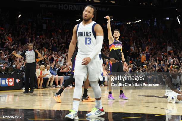 Devin Booker of the Phoenix Suns reacts after a three-point shot against the Dallas Mavericks during the second half of Game Two of the Western...