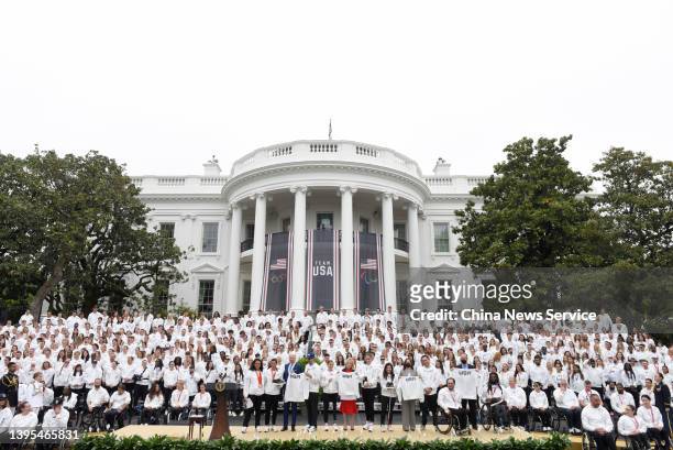 President Joe Biden, first lady Jill Biden, U.S. Vice President Kamala Harris and second gentleman Douglas Emhoff are presented with shoes and a Team...
