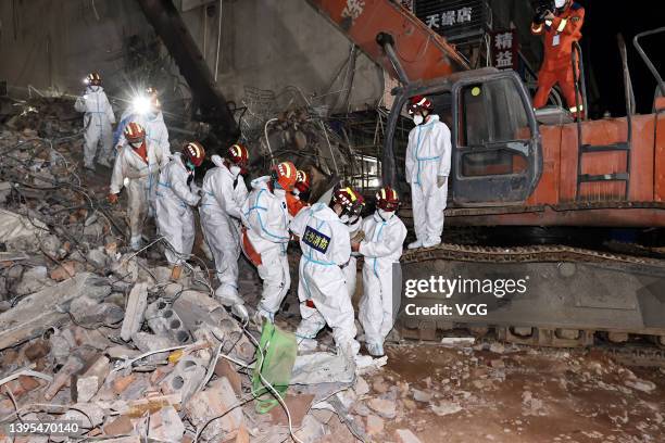 Rescuers carry the 10th survivor at the collapse site of a self-constructed residential building on May 5, 2022 in Changsha, Hunan Province of China....